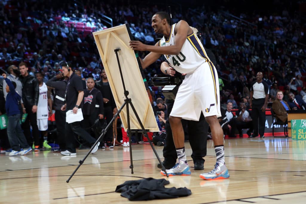 HOUSTON, TX - FEBRUARY 16: Jeremy Evans of the Utah Jazz signs a painting of himself after he dunked over it in the final round during the Sprite Slam Dunk Contest part of 2013 NBA All-Star Weekend at the Toyota Center on February 16, 2013 in Houston, Texas. NOTE TO USER: User expressly acknowledges and agrees that, by downloading and or using this photograph, User is consenting to the terms and conditions of the Getty Images License Agreement. (Photo by Ronald Martinez/Getty Images)