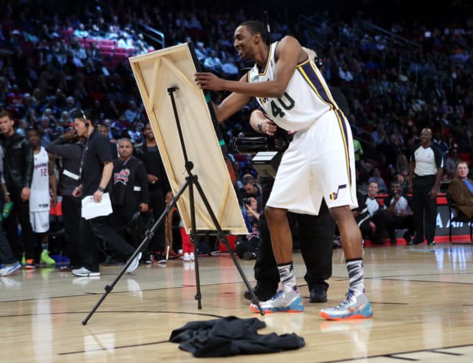 HOUSTON, TX - FEBRUARY 16: Jeremy Evans of the Utah Jazz signs a painting of himself after he dunked over it in the final round during the Sprite Slam Dunk Contest part of 2013 NBA All-Star Weekend at the Toyota Center on February 16, 2013 in Houston, Texas. NOTE TO USER: User expressly acknowledges and agrees that, by downloading and or using this photograph, User is consenting to the terms and conditions of the Getty Images License Agreement. (Photo by Ronald Martinez/Getty Images)